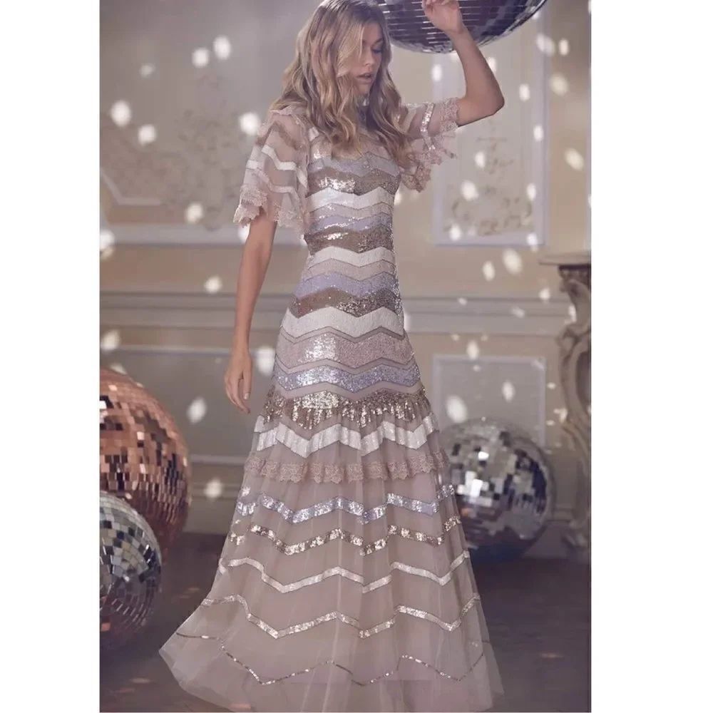 Needle & Thread
Alaska sequin-embellished tulle dress